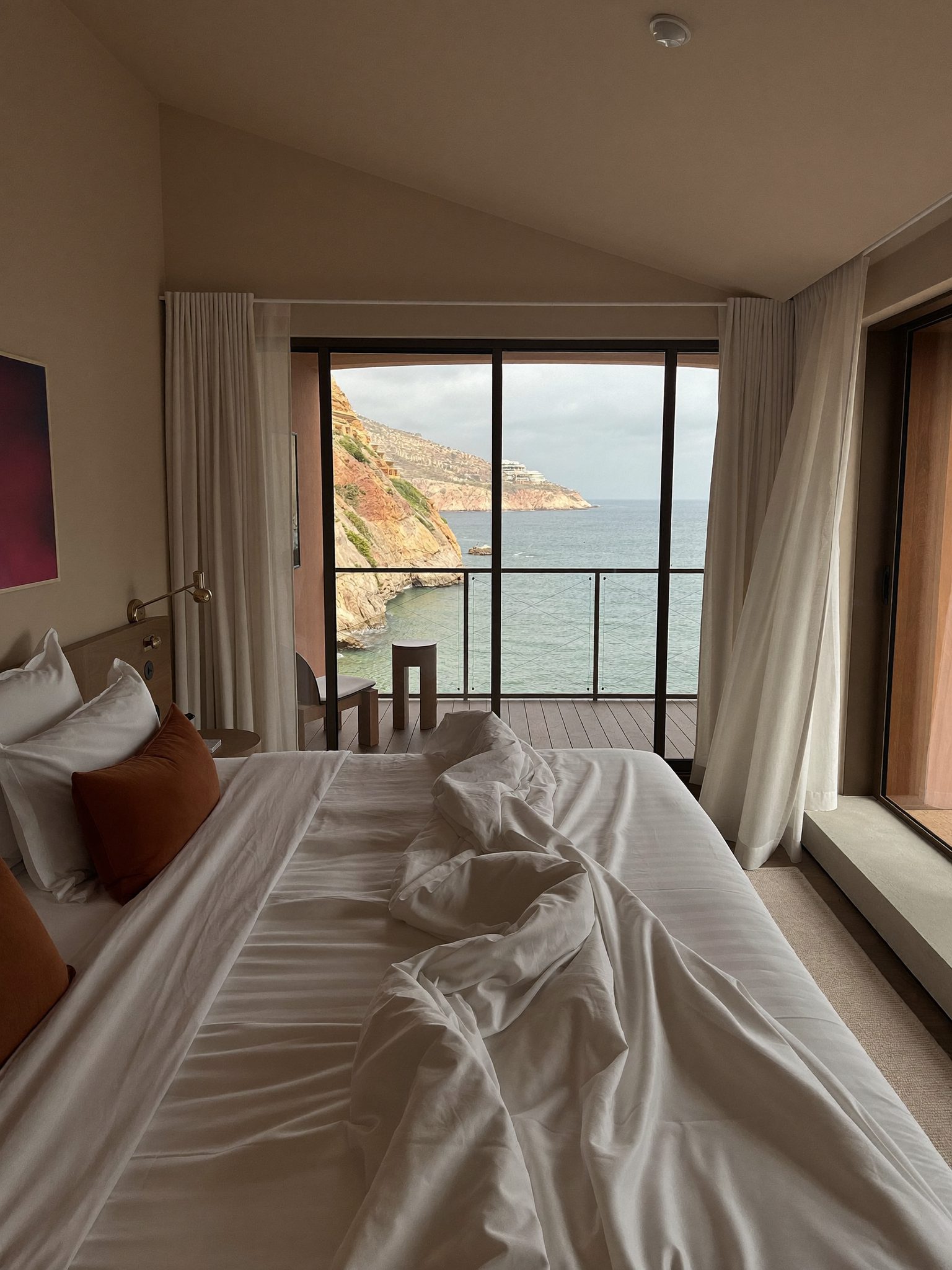 Coastal bedroom filled with morning light